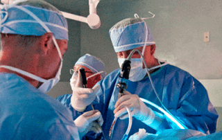 Doctors perform lumbar spine surgery in the operating room